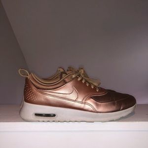 nike thea gold